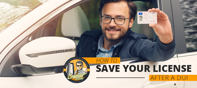 Person holding a saved license and smiling