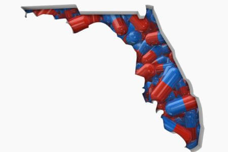 Florida state outline with pills inside.