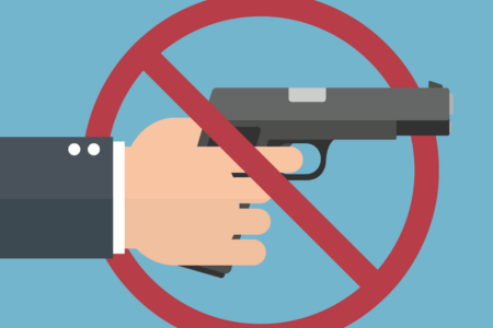 Graphic showing someone holding a gun with a "not allowed" symbol