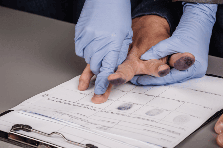 Person getting fingerprints taken