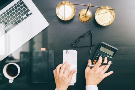 Person using calculator to determine how much a DUI costs in Florida