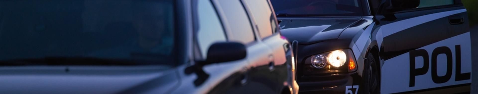 police car with flashing lights during a traffic stop