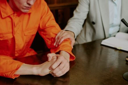 Aggravated battery defense attorney advising client